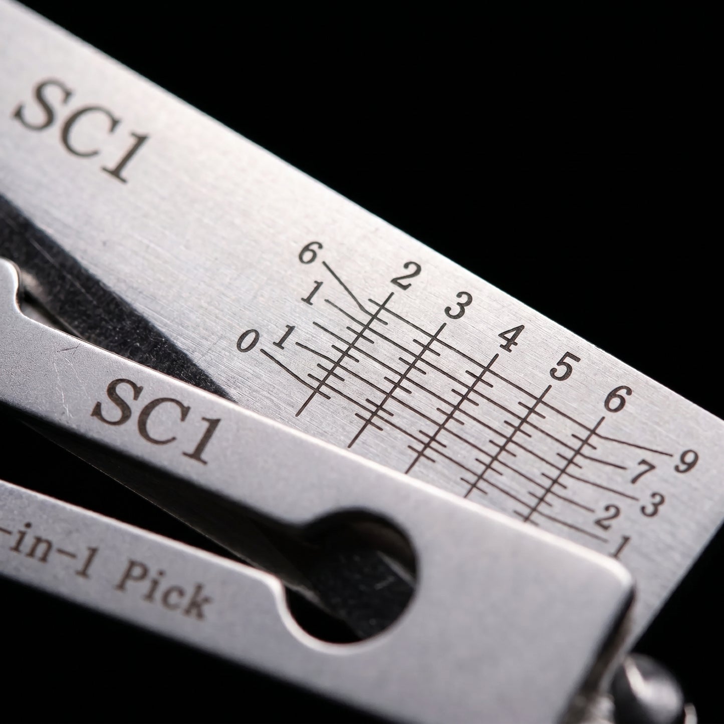 Extreme close-up of the laser-etched bitting depth markings on the decoder